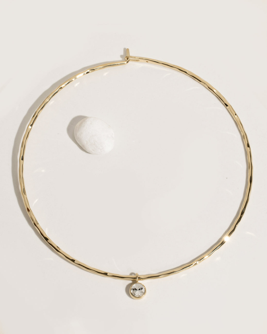 Gold rigid collar necklace with crystal accents