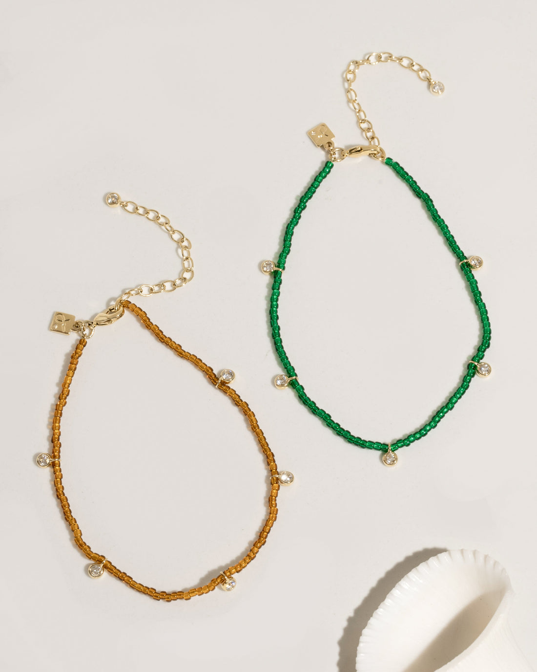 Beaded anklet with mixed crystal and gold bead accents on elastic cord